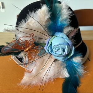 Elegant Black Feathered Hat with Blue Rose